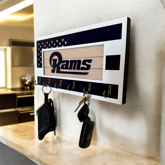 Los Angeles Rams home key holder that is white and blue with 6 hooks.
