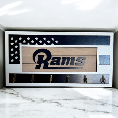 Los Angeles Rams home key holder that is white and blue with 6 hooks.