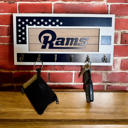 Los Angeles Rams home key holder that is white and blue with 6 hooks.